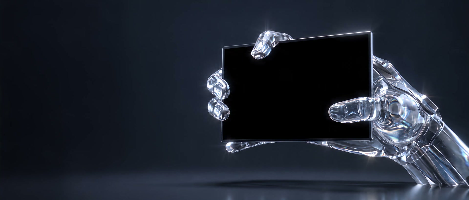 A hand of clear glass holds up a black screen against a deep navy background